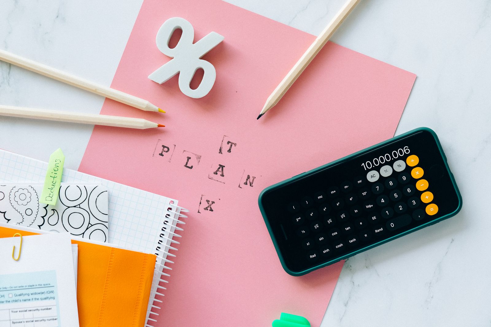 Sales tax calculation with a calculator and financial documents